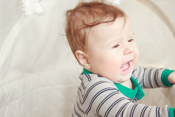 Portrait of joyfil, happiness baby in the bedroom, soft focus background