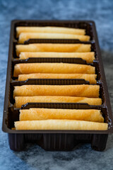 Krumkake. Czech Pirouette Cookies (Parizske Pecivo). Made with a Batter-like Dough Similar to Pancake Batter, Wafer Cookies Exist in Plastic Container Box / Package.
