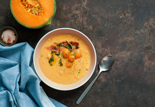Orage melon cold soup, with jamon, typical spanish dish