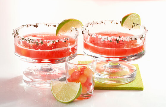 Daiquiris with watermelon, rum, orange liqueur and lime juice in glasses with sugared rims