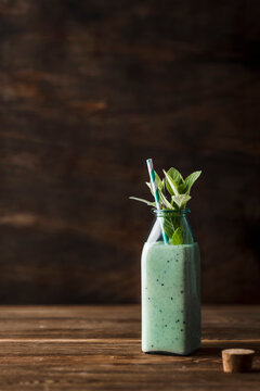 Smoothie with kiwi, banana, lemon juice, spirulina nad coconut yoghurt