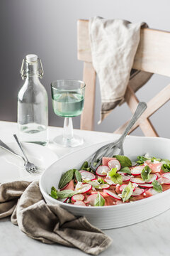 Watermelon, radish, mint and feta cheese salad. Spiced with olive oli, sea salt and black pepper