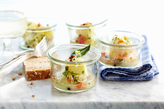 Marinated sour milk cheese with herbs, pepper, wine allspice and ground pepper