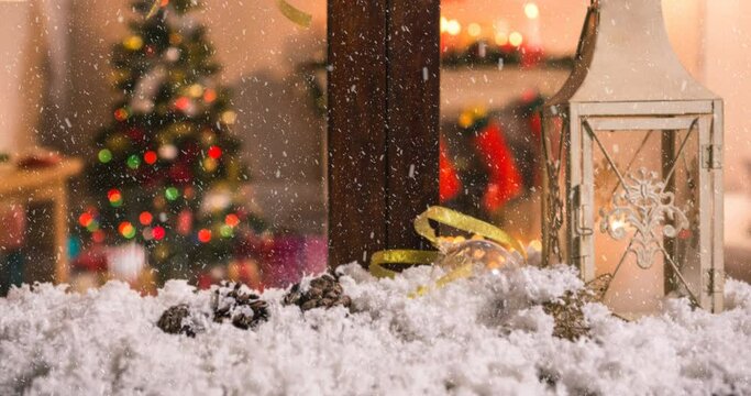 Animation of christmas tree seen through window with snow falling