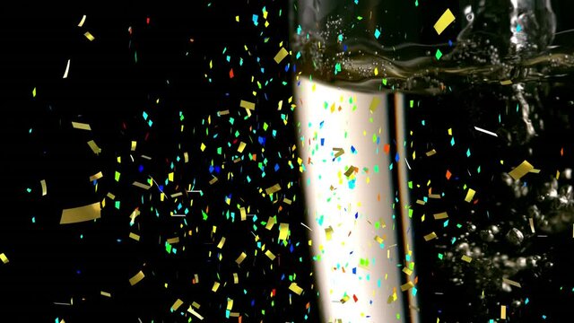 Animation of multi coloured confetti falling against champagne flute
