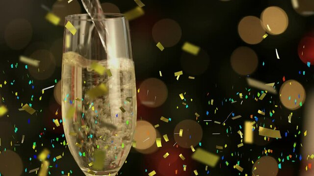 Animation of multi coloured confetti falling against champagne flute