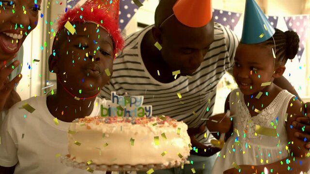 Animation of multi coloured confetti falling over family in party hats