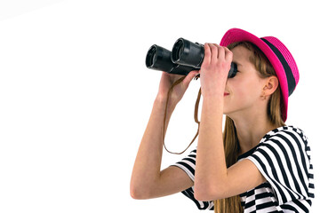 teenage girl looking to copy space with binoculars isolated on white background.