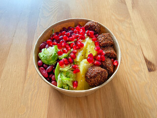Healthy Food Bowl with Falafel, Pomegranate Seeds, Pineapple, Mexican Red Kidney Beans and Brussel Sprouts in Plastic Bowl / Box or Container Package.