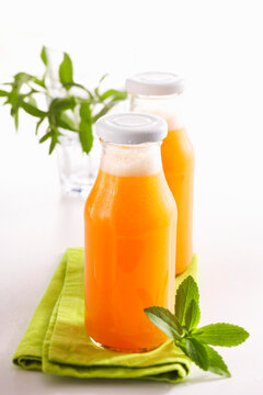 Homemade melon lemonade with stevia, cantaloupe, lime and mineral water