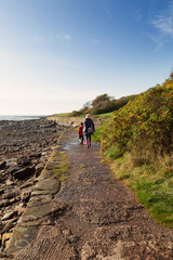 A mother and her 6 year old son walking alnong a coastal path in Crail, in the East Neuk of Fife. This is truly a beautiful part of the world with lots of rocky coastline.