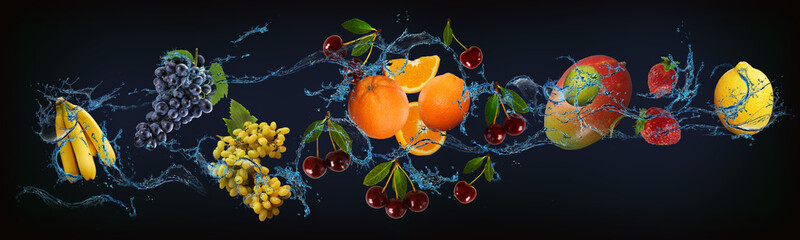 Panorama with fruits in water - juicy grapes, pomegranate, banana, orange, avocado are full of...