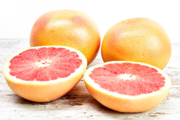 Grapefruit isolated on wooden table. Freshly harvested grapefruit