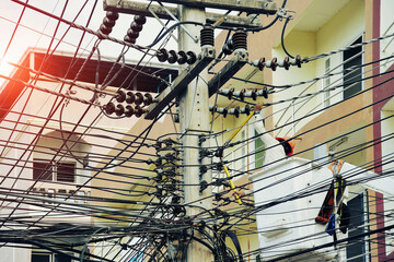 Many Electricians repairing wire on electric power pole workers cutting old electric line on...