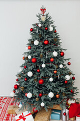 Christmas tree decor pine with gifts and garlands interior new year