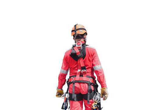 Male rope access worker wearing full safety harness clipping Karabiner into harness loop prior to abseiling working at height construction site isolated on white background clipping paths.