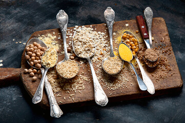 Healthy gluten free grains and flours on rustic wooden board