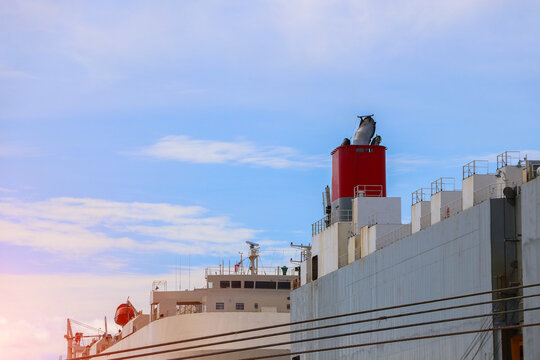 Chimney, exhaust pipe, large cargo barge during alongside in port