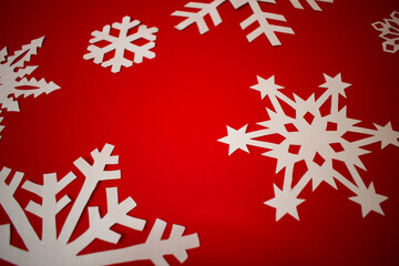 Red Christmas background with paper white snowflakes