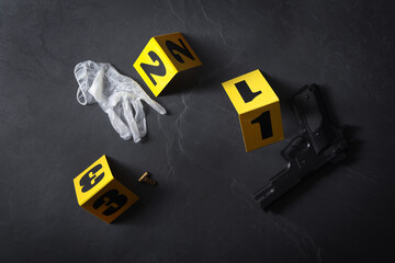 Flat lay composition with evidences and crime scene markers on black background