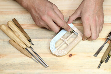 Handmade woodcarving with a strong chisel