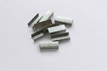 Fototapeta premium Metal staples bullet for stapler isolated on white background.