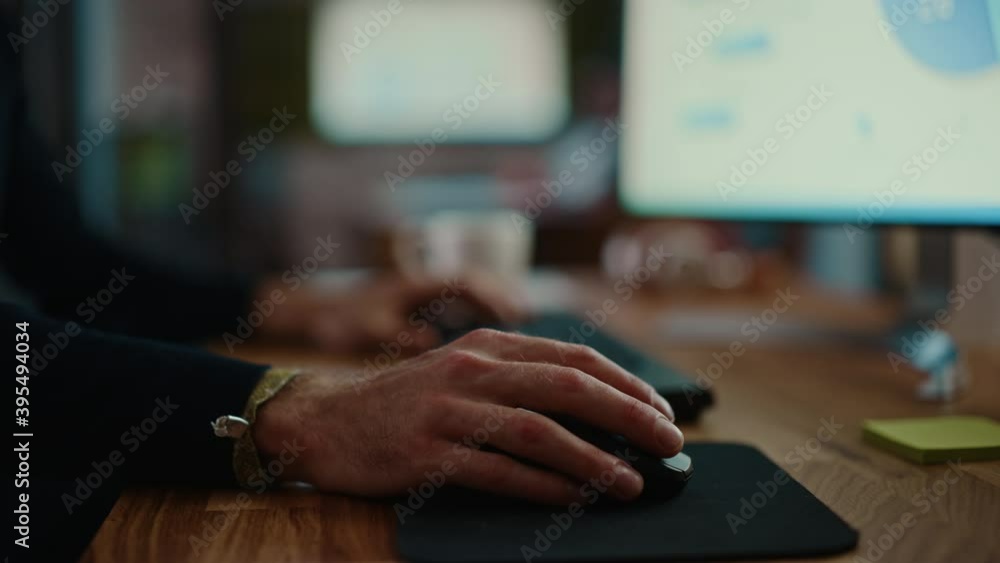 Aufkleber Close Up on Male Hands of a Specialist Working on Desktop Computer in a Busy Creative Office Environment. Manager First Types on a Keyboard and Then Uses the Mouse. He's Wearing a Craft Bracelet.