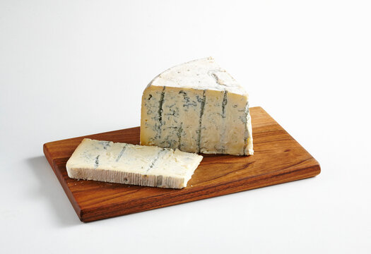 Gorgonzola with blue mold on a wooden board