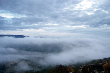 valley covered with mountain morning fog. Mist in the valley.