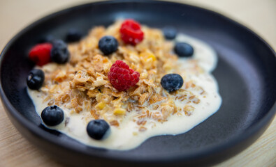 sweet breackfast. oatmeal with milk and berries