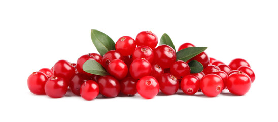 Pile of fresh cranberries with green leaves on white background