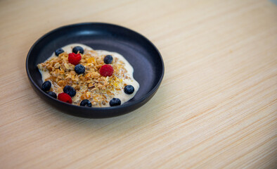 sweet breackfast. oatmeal with milk and berries