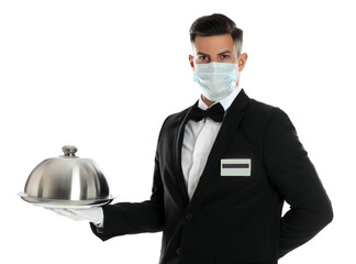 Waiter in medical face mask holding tray with lid on white background