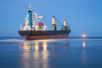 Refloating large ship, long exposure with text space