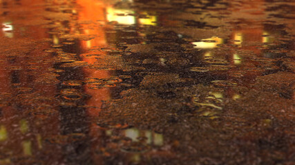 raindrops falling on the asphalt creating ripples in puddles