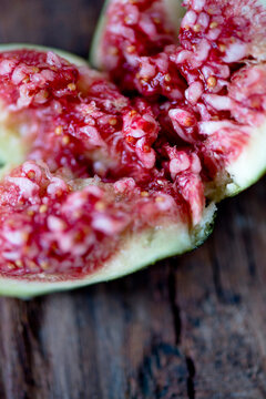 A close up of a torn open purple fig