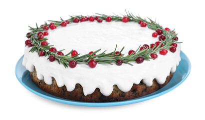 Traditional Christmas cake decorated with rosemary and cranberries isolated on white