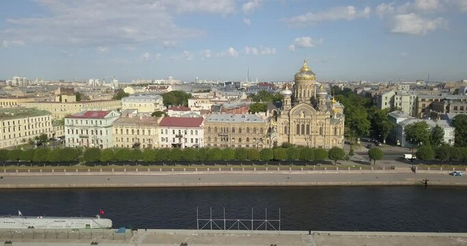 4K aerial sunny day video view of Saint Petersburg's old center embankment area, Neva River panorama, historical golden domes cathedral near Finnish Bay and surroundings of Russia's northern capital