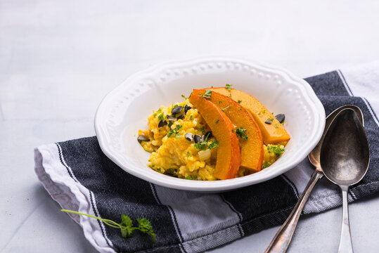 Vegan pumplin risotto with grilled pumpkin strips