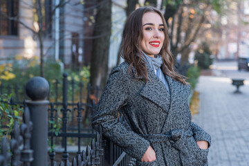 Portrait of a beautiful and happy girl outdoors. Beauty and fashion