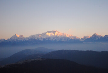 A magnificent view of sunrise over the Mt. Kanchanjunga, as seen from Sandakphu situated at 12,500 ft altitude in Darjeeling, India. This is the most popular tourist spot in North Bengal.