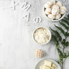 Hot chocolate cup with whipped cream and  white chocolate, Christmas decoration  on grey concrete background. Scandinavian style Xmas time