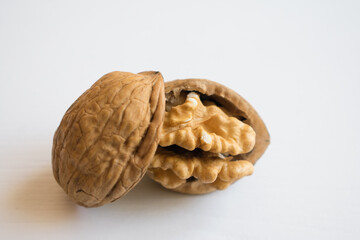 close-up cracked walnuts, white background.