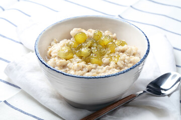 Oatmeal porridge with homemade gooseberry jam