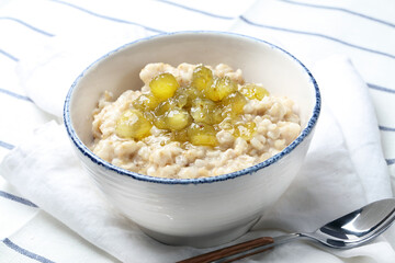 Oatmeal porridge with homemade gooseberry jam