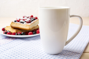 White coffee cappuccino mug mockup with waffles and berries