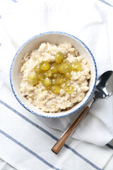 Oatmeal porridge with homemade gooseberry jam