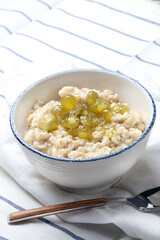 Oatmeal porridge with homemade gooseberry jam