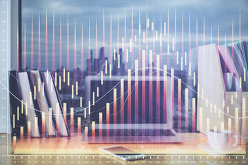 Financial chart drawing and table with computer on background. Double exposure. Concept of...