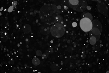 snow bokeh texture on black background